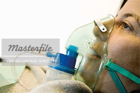 Patient wearing oxygen mask, close-up