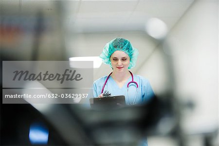 Nurse wearing surgical cap, low angle view