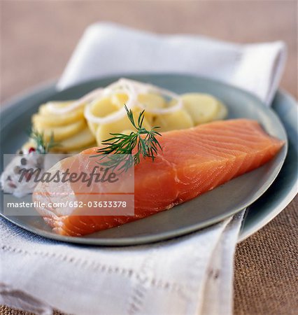 Thick piece of smoked salmon with potatoes