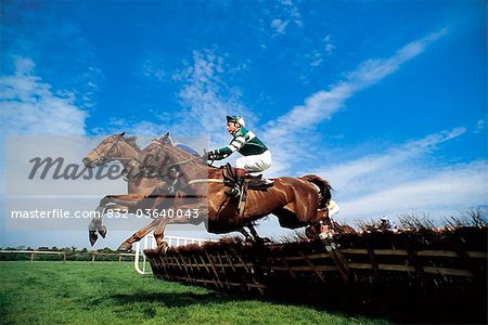 National Hunt Racing; Horses Jumping Over Fences During A Race