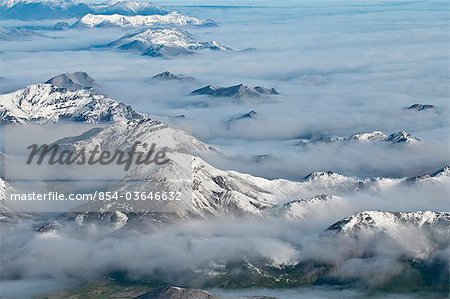 Aerial view of fog rolling over the northern edge of the Brooks Range in Gates of the Arctic National Park & Preserve, Arctic Alaska, Summer