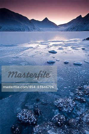 Close up of the frozen surface of Portage Lake at dawn in the Chugach National Forest, Southcentral Alaska, Winter
