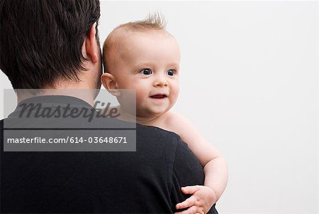 Father holding baby son