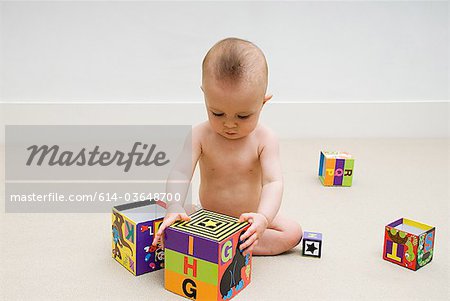 Baby playing with toy blocks