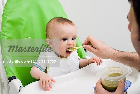 Baby being fed