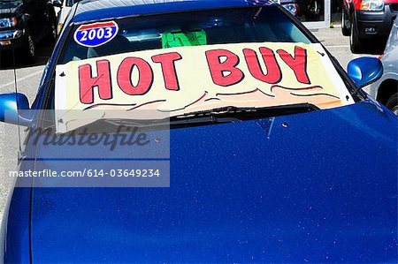 Car with sale sign