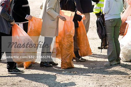 Group of volunteers picking up trash