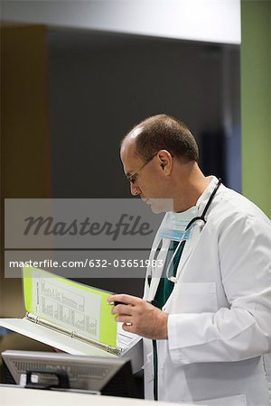 Doctor reviewing medical chart