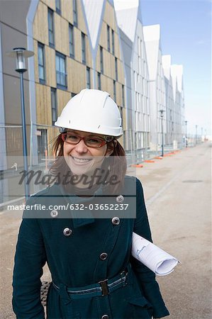 Female architect in hard hat, portrait