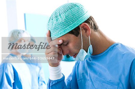 Surgeon under stress  in operating room