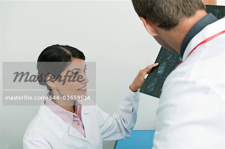 Doctors looking at an MRI