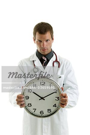 Doctor holding clock