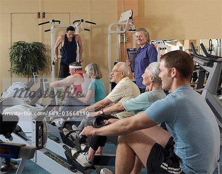 seniors training at gym with instructor