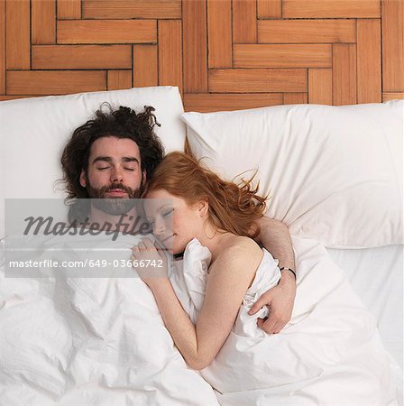 Couple sleeping in bed