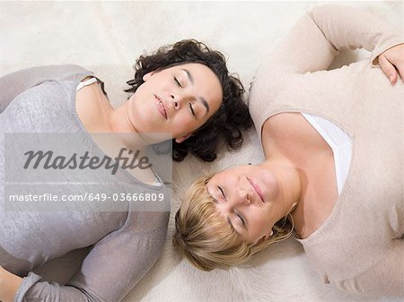 Two women relaxing on the floor