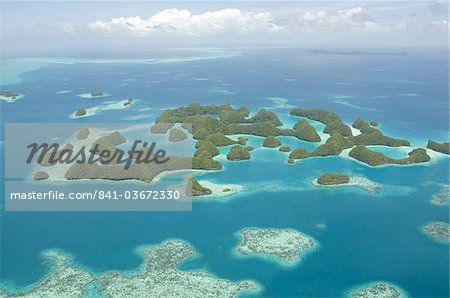 Seventy Islands (Ngerukewid Islands Wildlife Preserve), forest-covered limestone rock, protected as a Nature Reserve, so can only be seen from the air, Palau, Micronesia, Western Pacific Ocean, Pacific