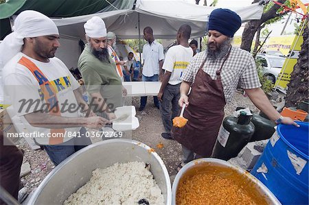 Preparing food for distribution with United Sikhs after the January 2010 earthquake, Port au Prince, Haiti, West Indies, Caribbean, Central America