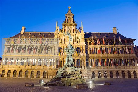 Baroque Brabo fountain, built in 1887, by Jef Lambeaux, Stadhuis (city hall) illuminated at night, Antwerp, Flanders, Belgium, Europe