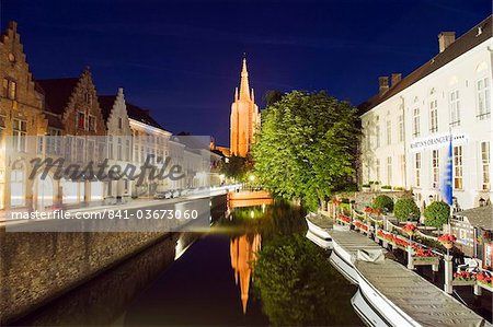 Reflection of Onze Lieve Vrouwekerk (Church of Our Lady), lit up at night, Old Town, UNESCO World Heritage Site, Bruges, Flanders, Belgium, Europe