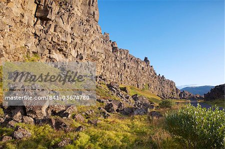 The Almannagja (All Man's Gorge) cliff face is the backdrop of the Althing, legislative assembly of the past, also the edge of the north American tectonic plate, Thingvellir National Park, UNESCO World Heritage Site, south-west Iceland (Sudurland), Iceland, Polar Regions