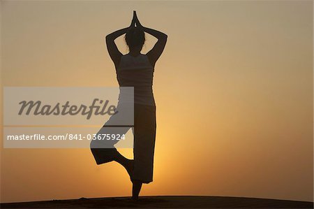 Sunset meditation in the desert, Abu Dhabi, United Arab Emirates, Middle East