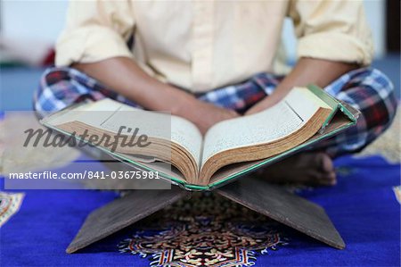 Muslim man reading the Quran in mosque, Ho Chi Minh City, Vietnam, Indochina, Southeast Asia, Asia