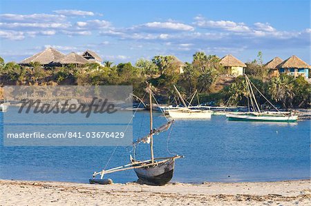 Outrigger boat lying on bank of sand, Antsanitian Beach Resort, Mahajanga, Madagascar, Indian Ocean, Africa