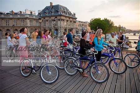 Visitors touring the city by bicycle, Paris, France, Europe