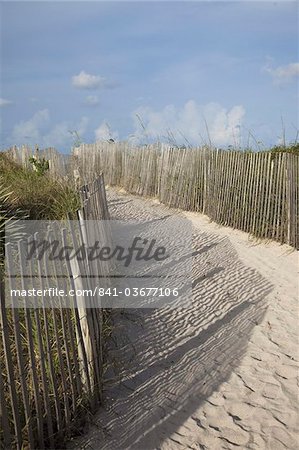 Sand held in place by fence on South Beach in Miami Beach, Florida, United States of America, North America