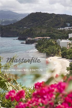 Couple walking along sandy stretch of Magazine Beach in Grenada, Windward Islands, West Indies, Caribbean, Central America