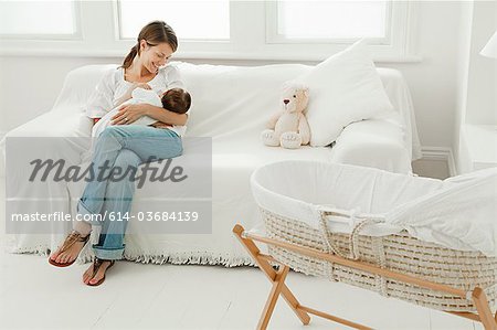 Mother and baby on sofa