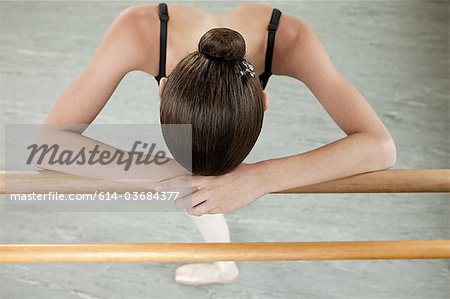 Ballerina resting on barre