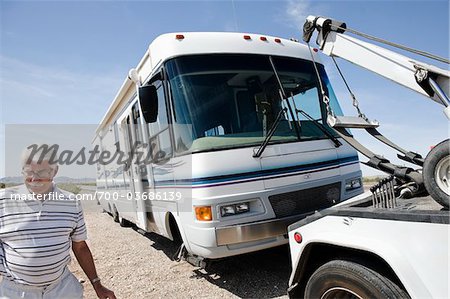 Man Having RV Towed in Desert, near Yuma, Arizona, USA