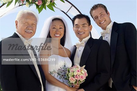 Bride and Groom with father and best man, outdoors, (portrait)