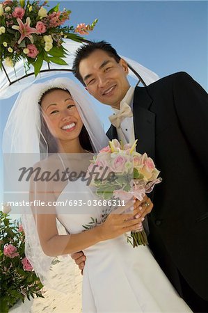 Bride and Groom under archway, (portrait)