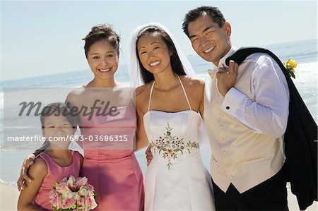 Bride and Groom with bridesmaid and sister, (portrait)