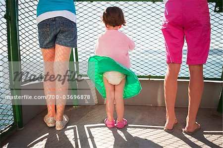 Little Girl's Skirt Blowing in Wind on Ferry Boat, San Juan Islands, Washington State, USA