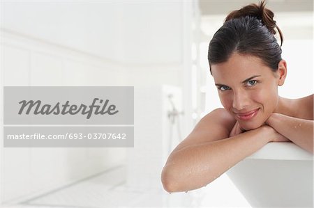 Woman relaxing in bathtub, portrait