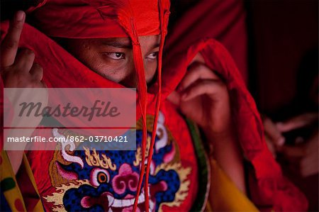 Bhutan. Participants at the tsechu in Wangdue Phodrang getting ready for a performance.