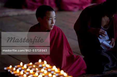 Monks at the sacred thread ceremony for the deceased in the monestery un Ura, Bumthang, Bhutan