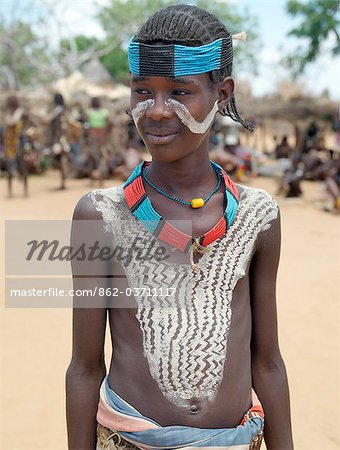 A smart young Hamar youth at Turmi Market.The Hamar are semi-nomadic pastoralists who live in harsh country around the Hamar Mountains of Southwest Ethiopia. Their whole way of life is based on the needs of their livestock. Cattle are economically and culturally their most important asset.
