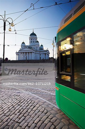 Tram passing in front of Lutheran Cathedral in Senate Square, Helsinki, Finland
