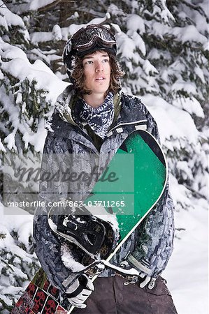 France,Chamonix. A young man in snowboarding gear