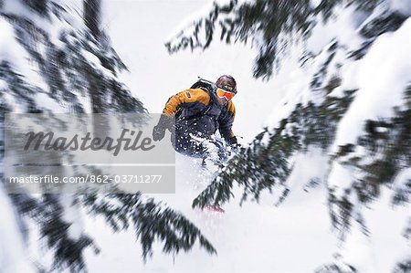 A snowboarder on the Grands Montets,Chamonix,France.
