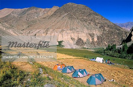 Trekking expedition camped on a harvested field, Tangyar, Ladakh, North West India