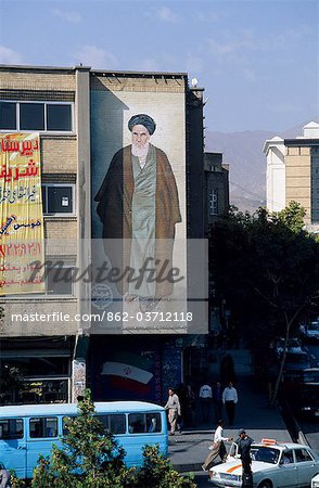 Modern mural of mullah looks down on a street in Tabriz.