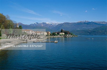 West side of Lake Maggiore showing snow capped mountains and the town of Baveno. Queen Victoria stayed here at the Villa Clara.