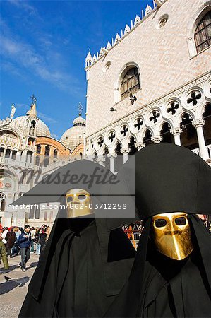 Venice Carnival People in Costumes and Masks outside St Marks Cathedral