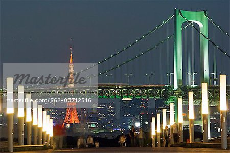 Rainbow Bridge and Tokyo Tower,people in the foreground taking an evening stroll.