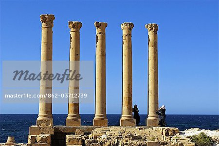 Libya, Sabratha. Arab tourists taking photographs.